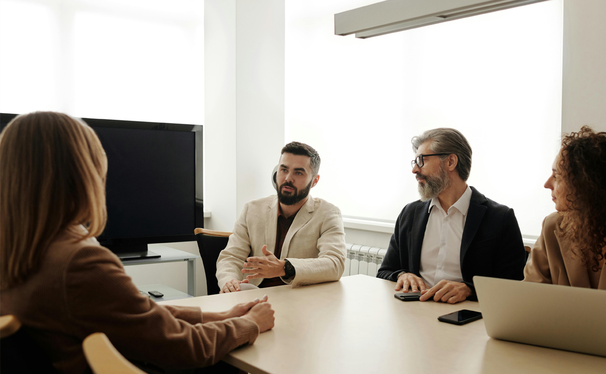 Healthcare leaders discussing strategies for preventing physician burnout in organizational meeting