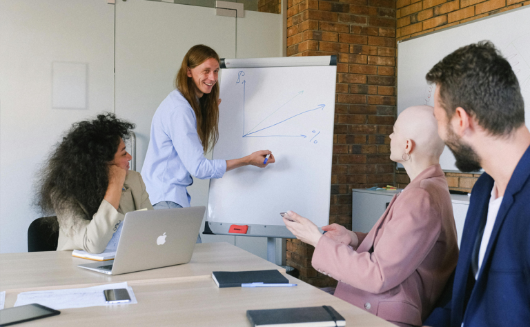 Healthcare leader reviewing physician burnout reduction implementation roadmap with organizational wellness data